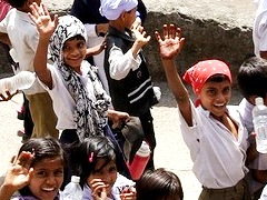 Indian kids waving hands Ajanta Caves